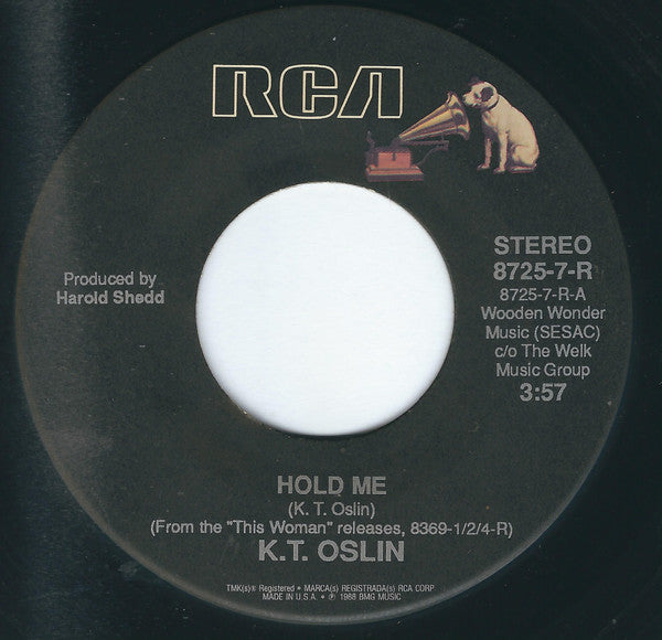 K.T. Oslin : Hold Me / She Don't Talk Like Us No More (7")