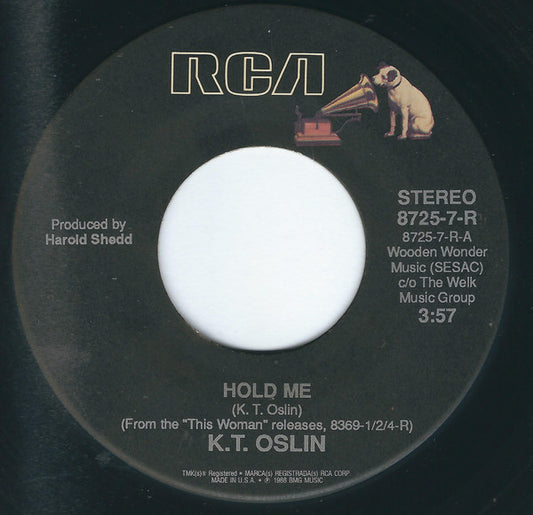 K.T. Oslin : Hold Me / She Don't Talk Like Us No More (7")