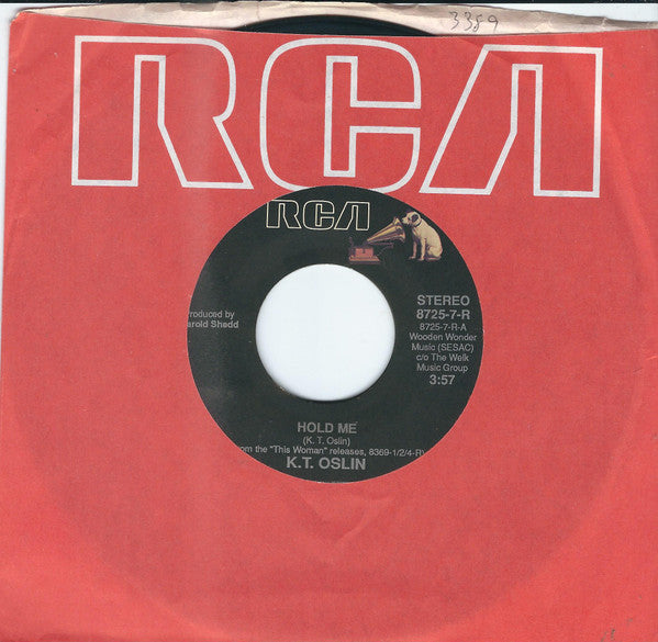K.T. Oslin : Hold Me / She Don't Talk Like Us No More (7")