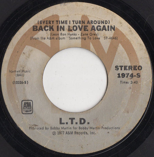 L.T.D. : (Every Time I Turn Around) Back In Love Again  (7", Single, Styrene, Ter)