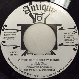Dewayne (D.W.) Bowman And The I.R.S. (3) And Krissi : Victims Of The Pretty Things In Life / I'm Sorry (7")